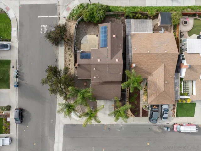 an aerial view of a house with a yard and a garage