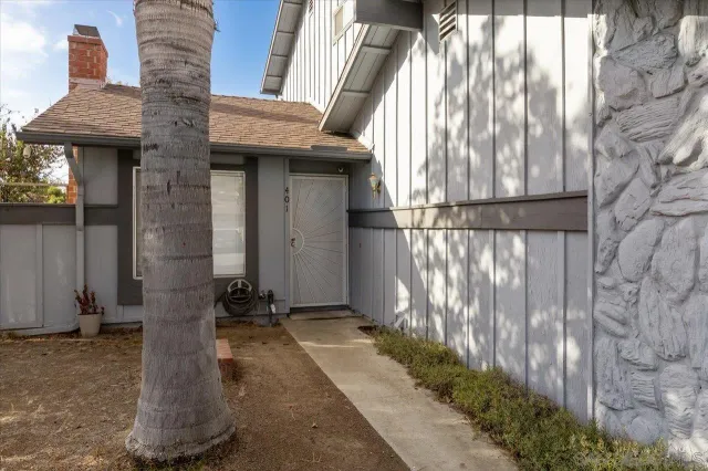 a view of a brick house with a street