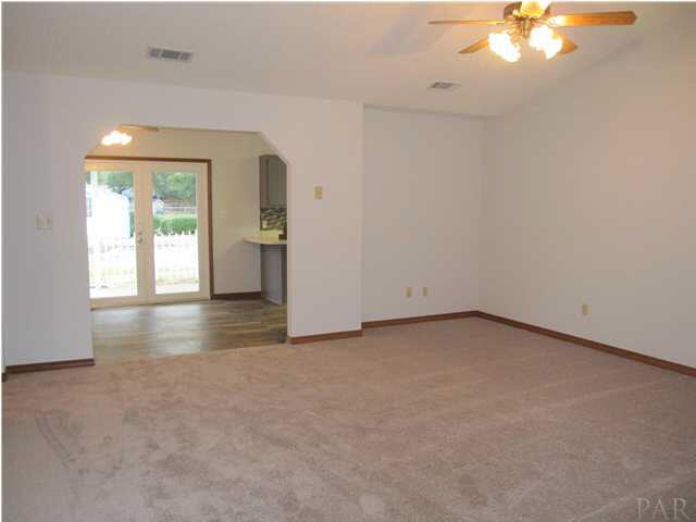 4240 Galt City Road Milton, FL 32583 - Photo 11 of 25 View of the great room from the front door. Love the arched entry to the eat-in kitchen!