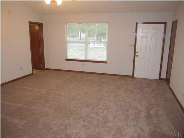 4240 Galt City Road Milton, FL 32583 - Photo 12 of 25 View of the great room from the kitchen. Master bedroom to your left. Coat closet to the right of the front door.