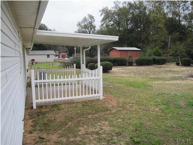 4240 Galt City Road Milton, FL 32583 - Photo 22 of 25 View from the door at the back of the garage.