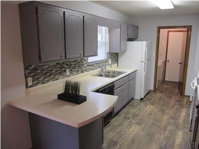 4240 Galt City Road Milton, FL 32583 - Photo 3 of 25 Kitchen cabinets received a fresh coat of custom paint as well as the entire interior of the home Feb. 2013.