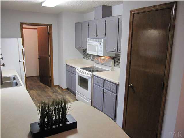 4240 Galt City Road Milton, FL 32583 - Photo 4 of 25 View from the eat-in area. Large pantry to your right. Laundry room ahead.