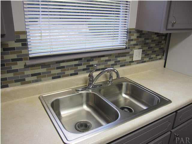 4240 Galt City Road Milton, FL 32583 - Photo 5 of 25 New Mosaic tile backsplash & faucet.