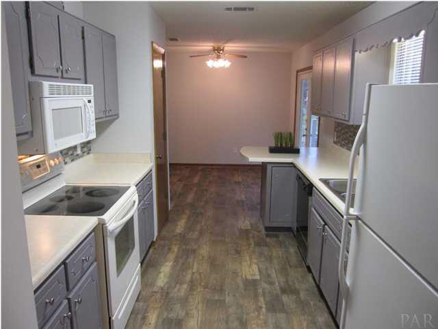 4240 Galt City Road Milton, FL 32583 - Photo 6 of 25 View from the laundry room. You will love the NEW flooring with the look of real wood!