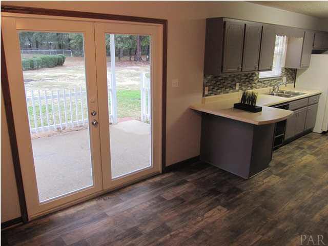 4240 Galt City Road Milton, FL 32583 - Photo 9 of 25 View of the eat-in area from the family room. Breakfast bar seating for 2!