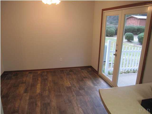 4240 Galt City Road Milton, FL 32583 - Photo 10 of 25 French doors lead out to the covered patio. Family room to your left.