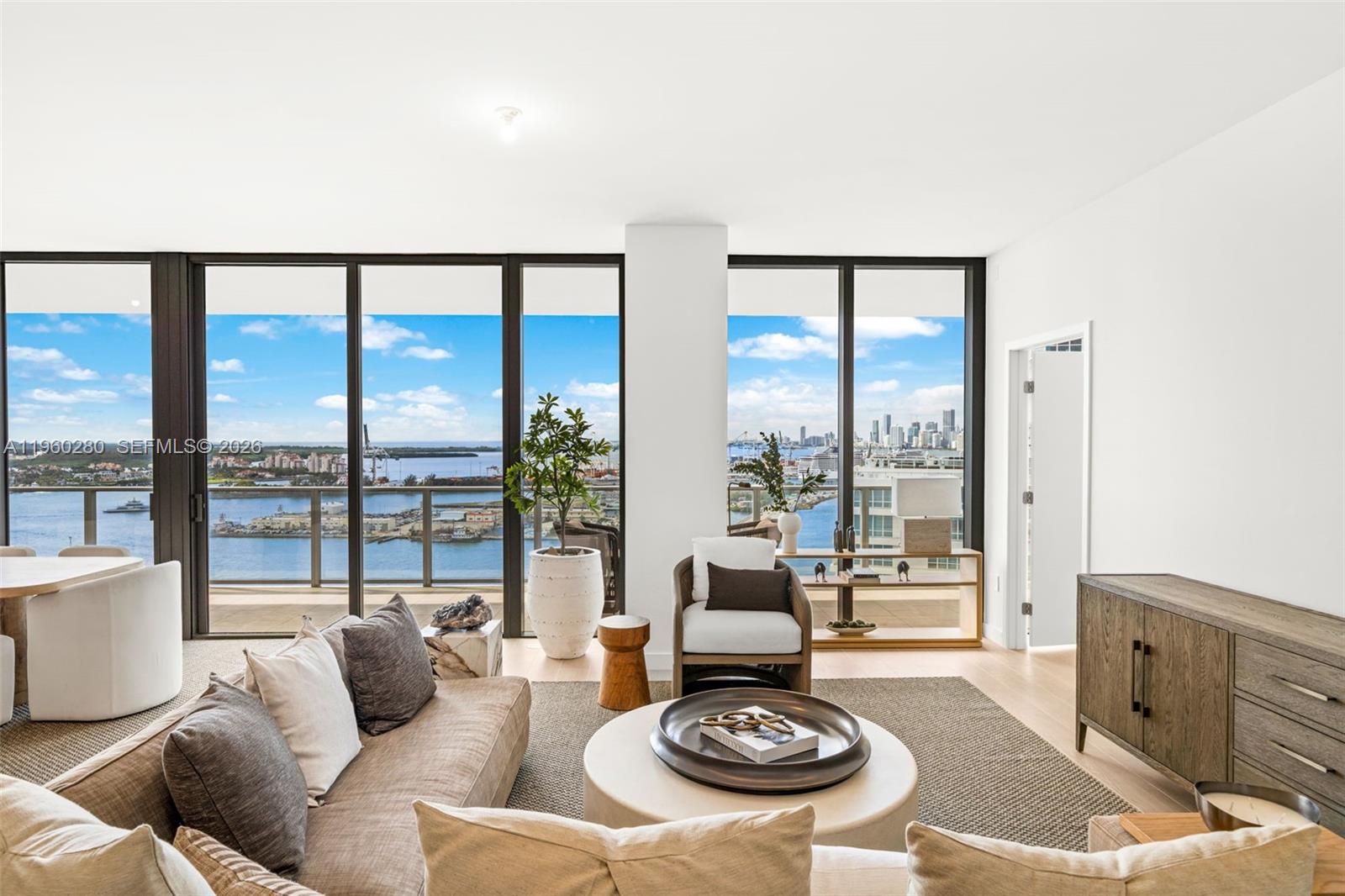 500 Alton Road, Unit 2203 Miami Beach, FL 33139 - Photo 14 of 36 a living room with furniture and a large window
