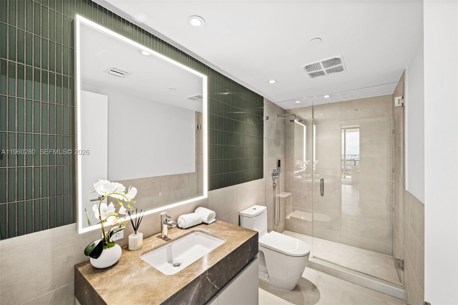 500 Alton Road, Unit 2203 Miami Beach, FL 33139 - Photo 15 of 36 a bathroom with a bathtub shower sink and toilet