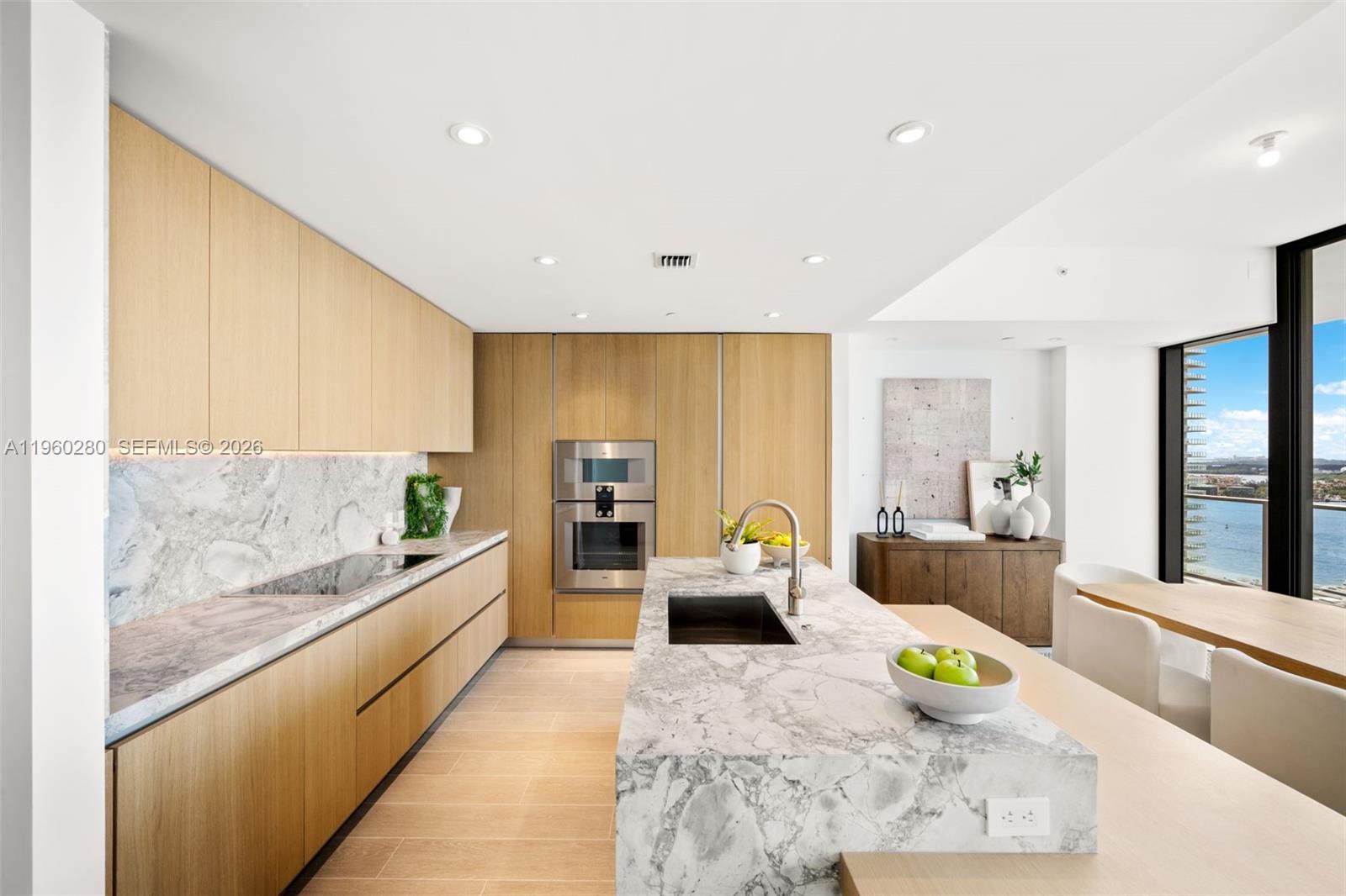 500 Alton Road, Unit 2203 Miami Beach, FL 33139 - Photo 30 of 36 a large white kitchen with a large window