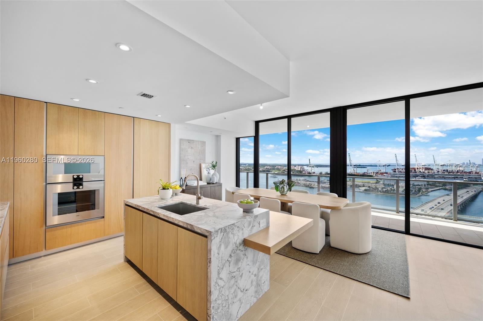 500 Alton Road, Unit 2203 Miami Beach, FL 33139 - Photo 31 of 36 a very nice looking living room with a large window and a couch