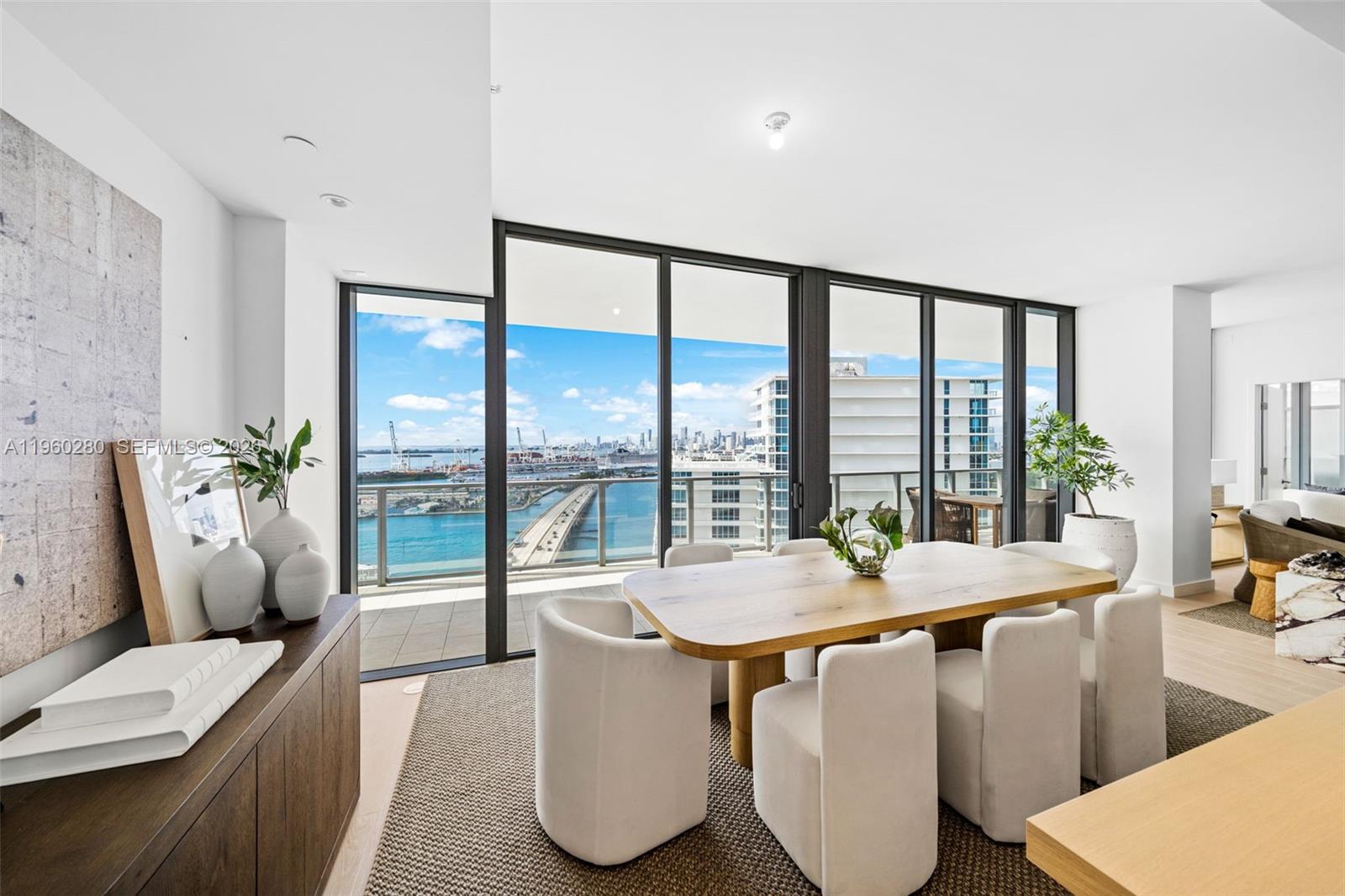 500 Alton Road, Unit 2203 Miami Beach, FL 33139 - Photo 33 of 36 a living room with furniture and a large window