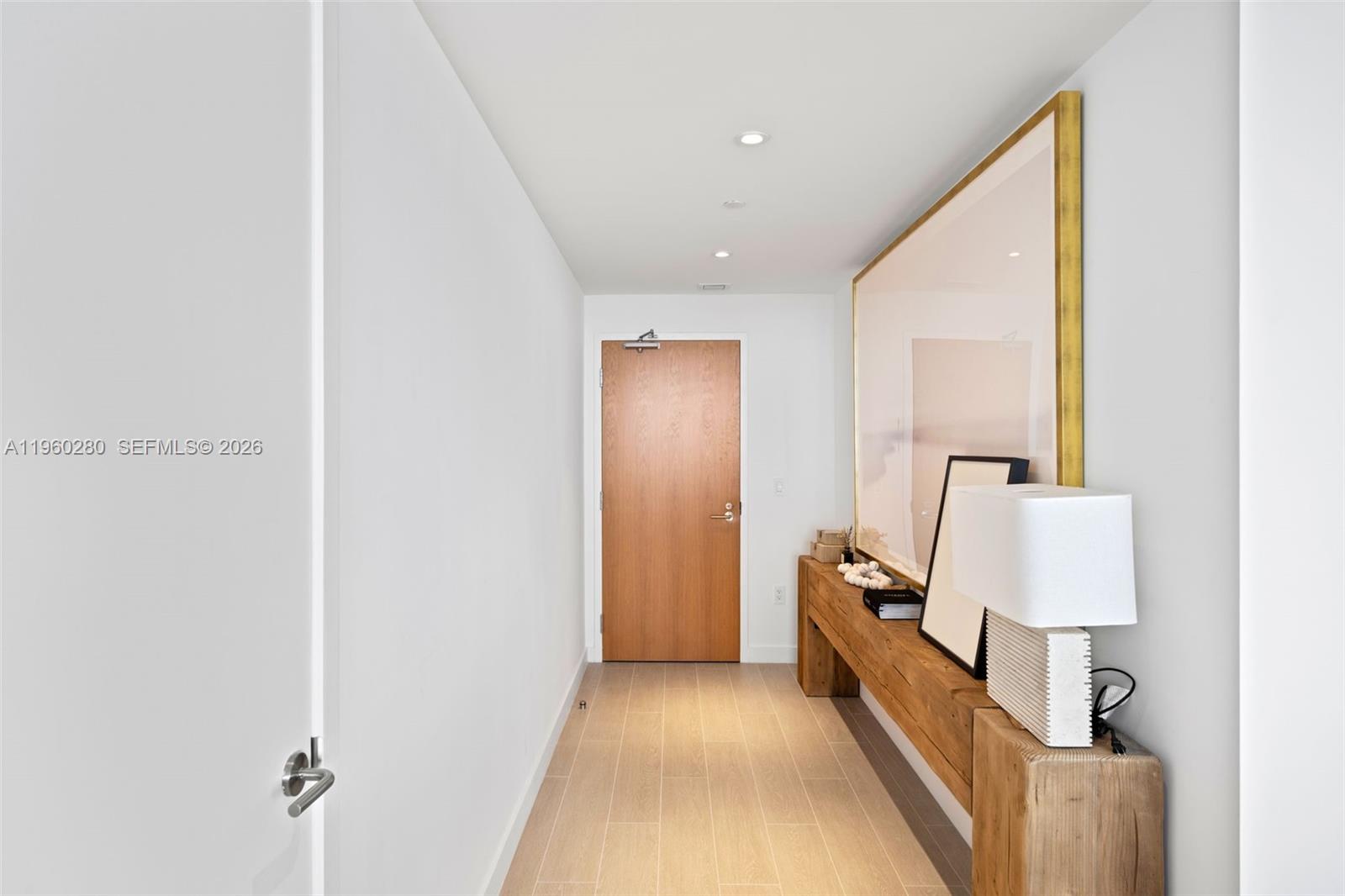 500 Alton Road, Unit 2203 Miami Beach, FL 33139 - Photo 34 of 36 a view of a hallway with bed and a couch