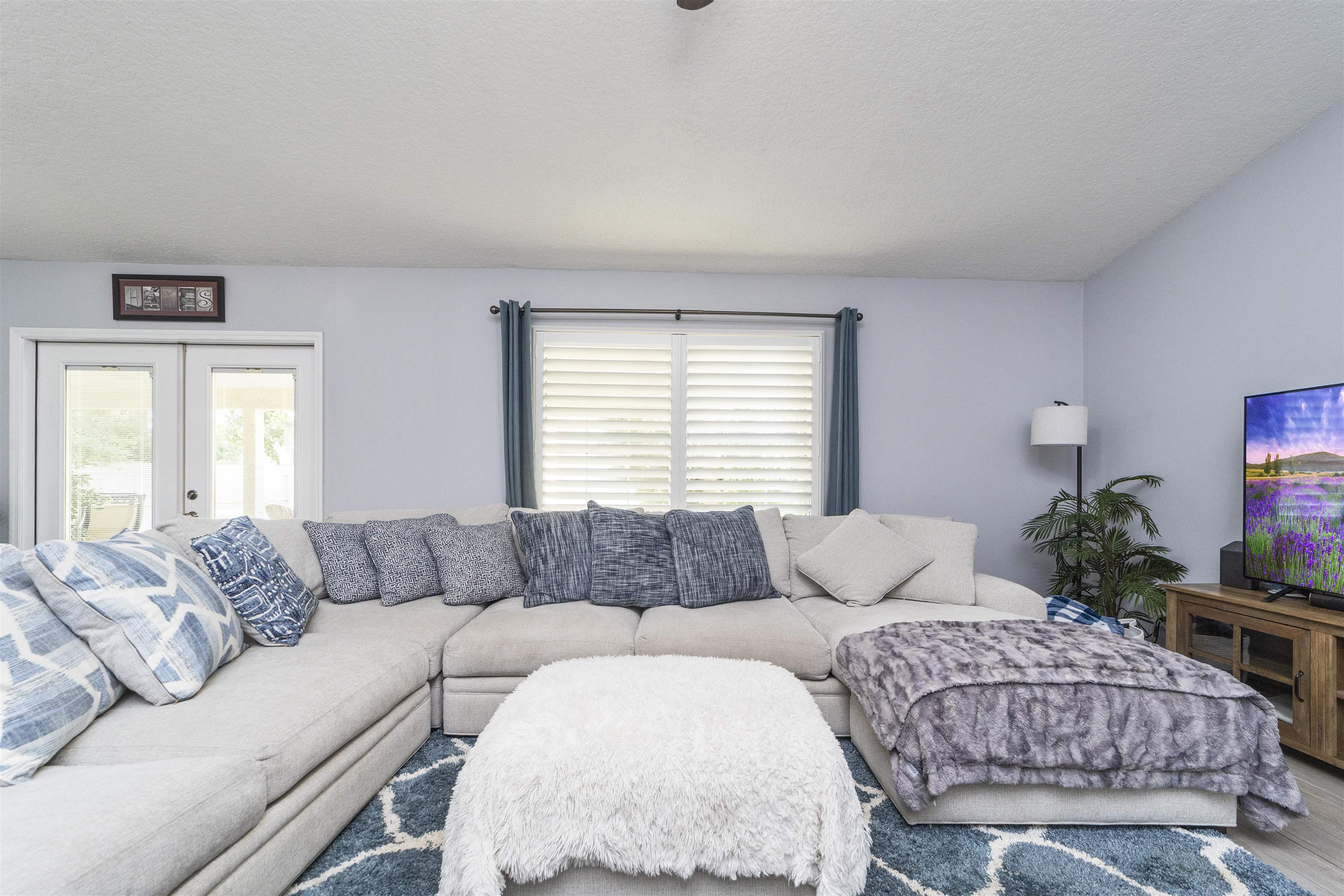 845 Wildwood Drive St. Augustine, FL 32086 - Photo 12 of 58 a living room with furniture and a large window