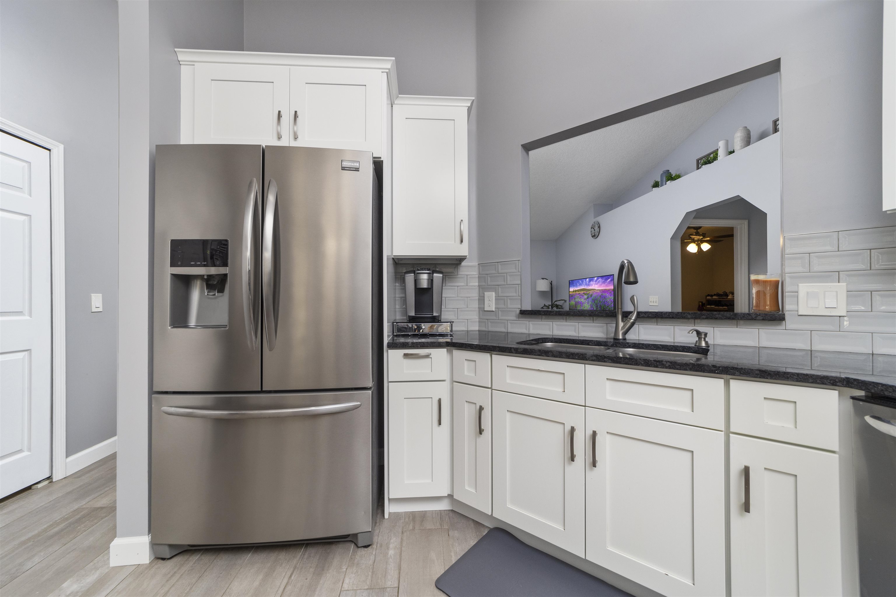 845 Wildwood Drive St. Augustine, FL 32086 - Photo 18 of 58 a kitchen with cabinets and stainless steel appliances