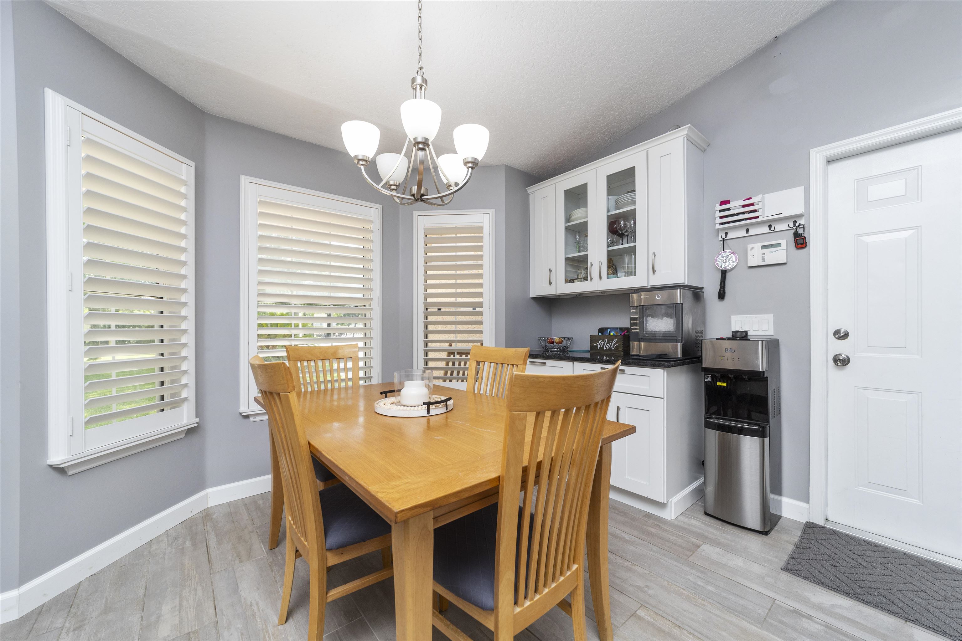 845 Wildwood Drive St. Augustine, FL 32086 - Photo 20 of 58 a view of a dining room with furniture window and wooden floor