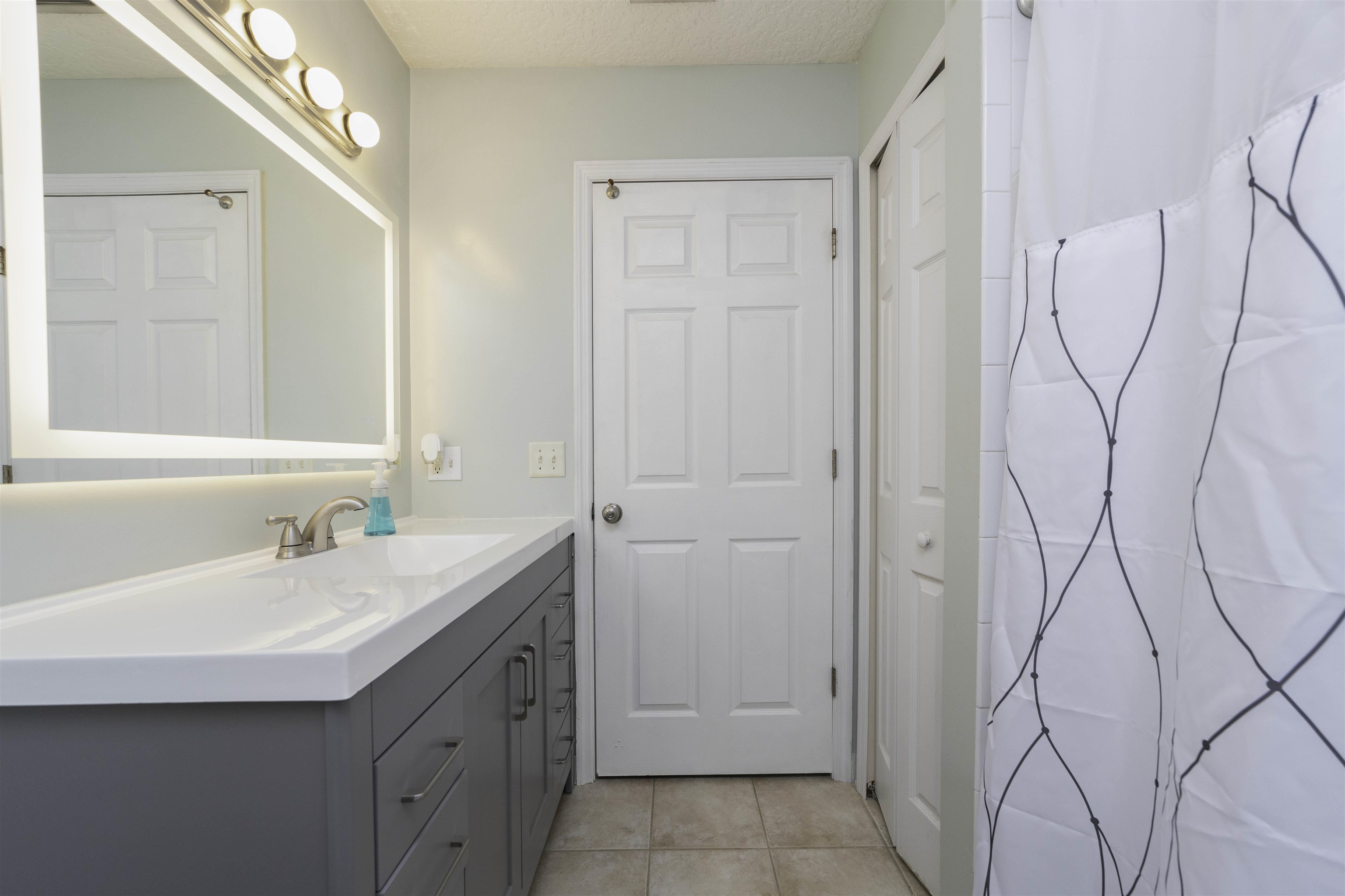 845 Wildwood Drive St. Augustine, FL 32086 - Photo 27 of 58 a bathroom with a sink and a mirror