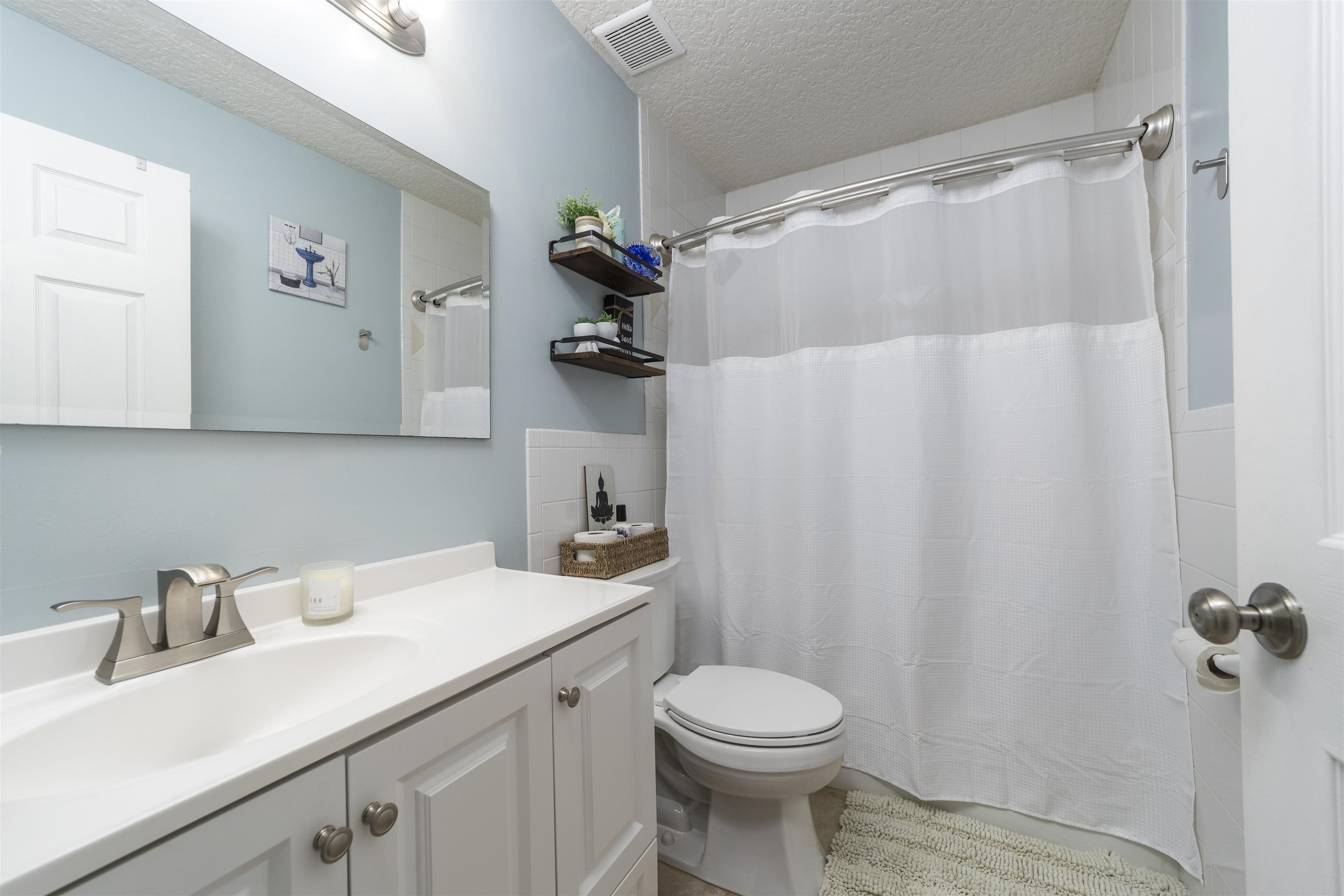 845 Wildwood Drive St. Augustine, FL 32086 - Photo 30 of 58 a bathroom with a sink and a toilet