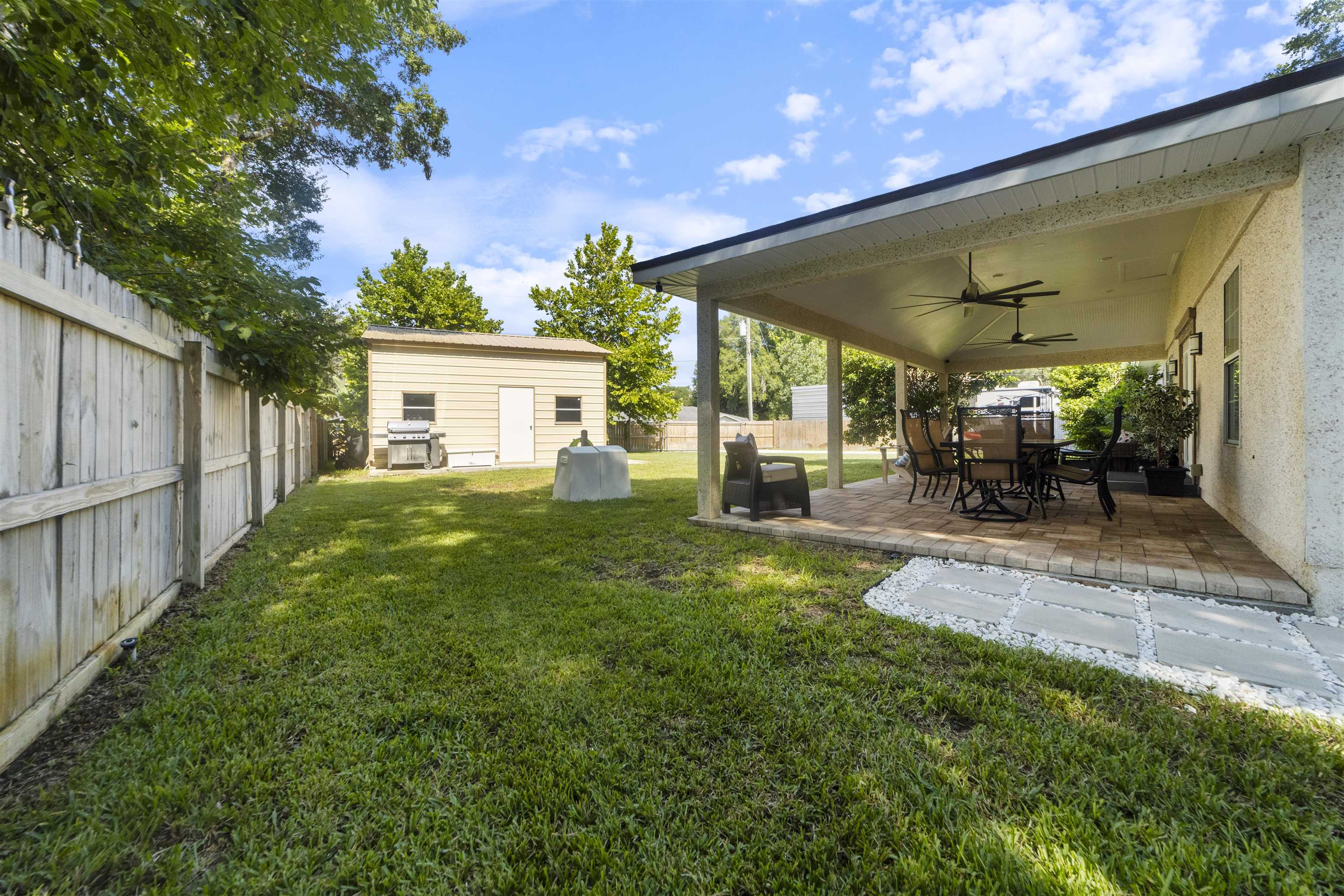 845 Wildwood Drive St. Augustine, FL 32086 - Photo 45 of 58 a view of a house with backyard and sitting area