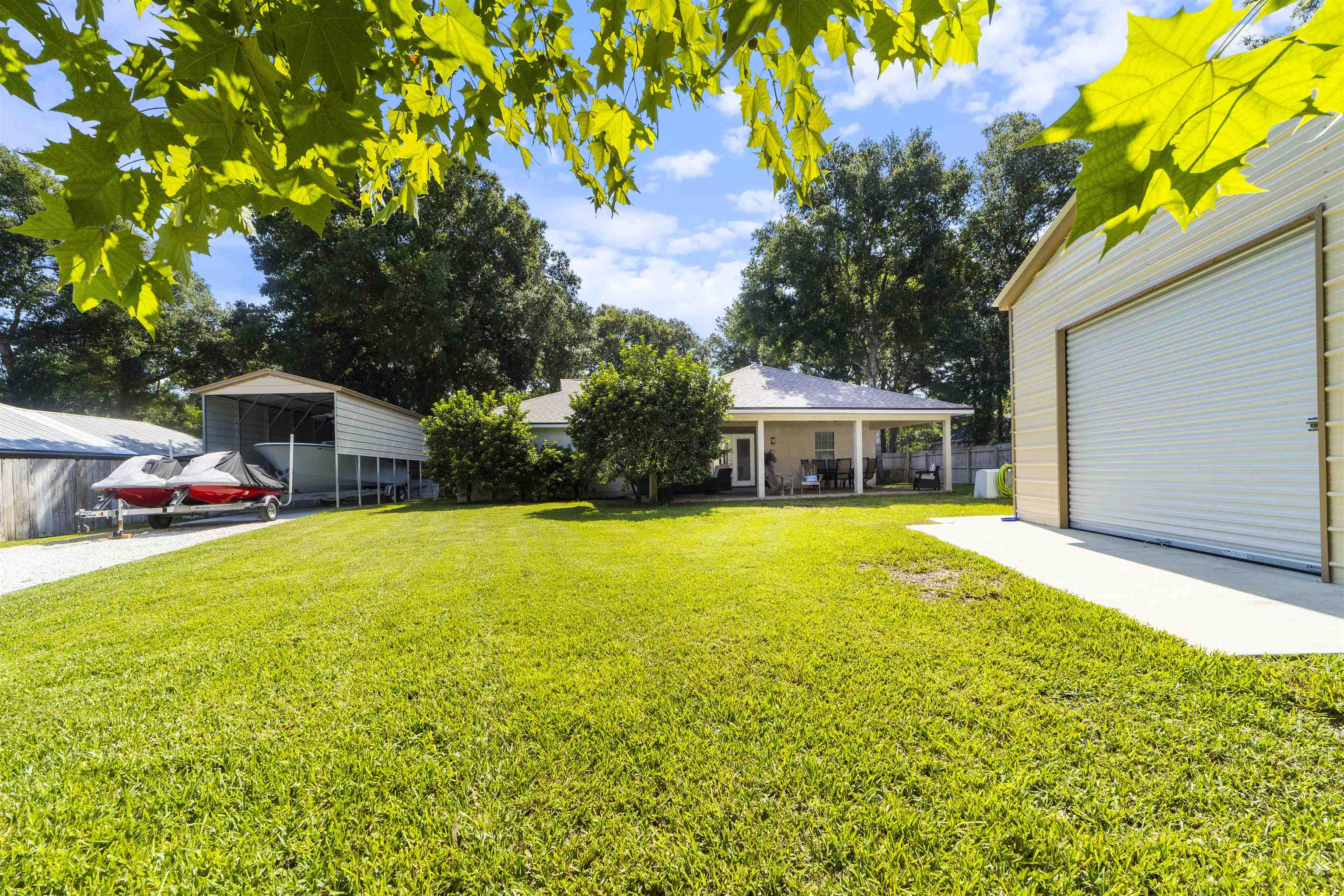 845 Wildwood Drive St. Augustine, FL 32086 - Photo 50 of 58 a front view of house with yard and swimming pool