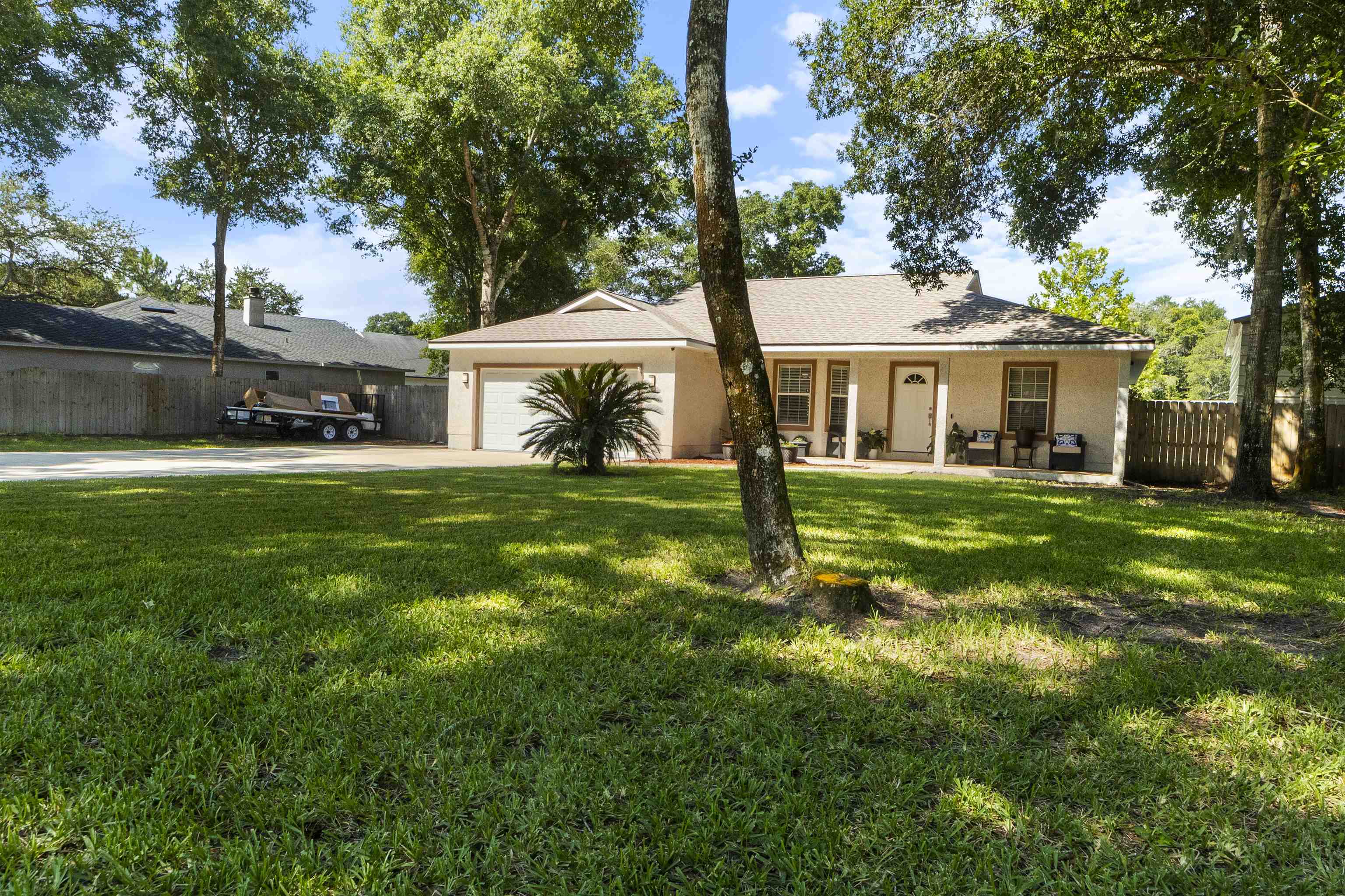 845 Wildwood Drive St. Augustine, FL 32086 - Photo 56 of 58 a house view with a sitting space and garden