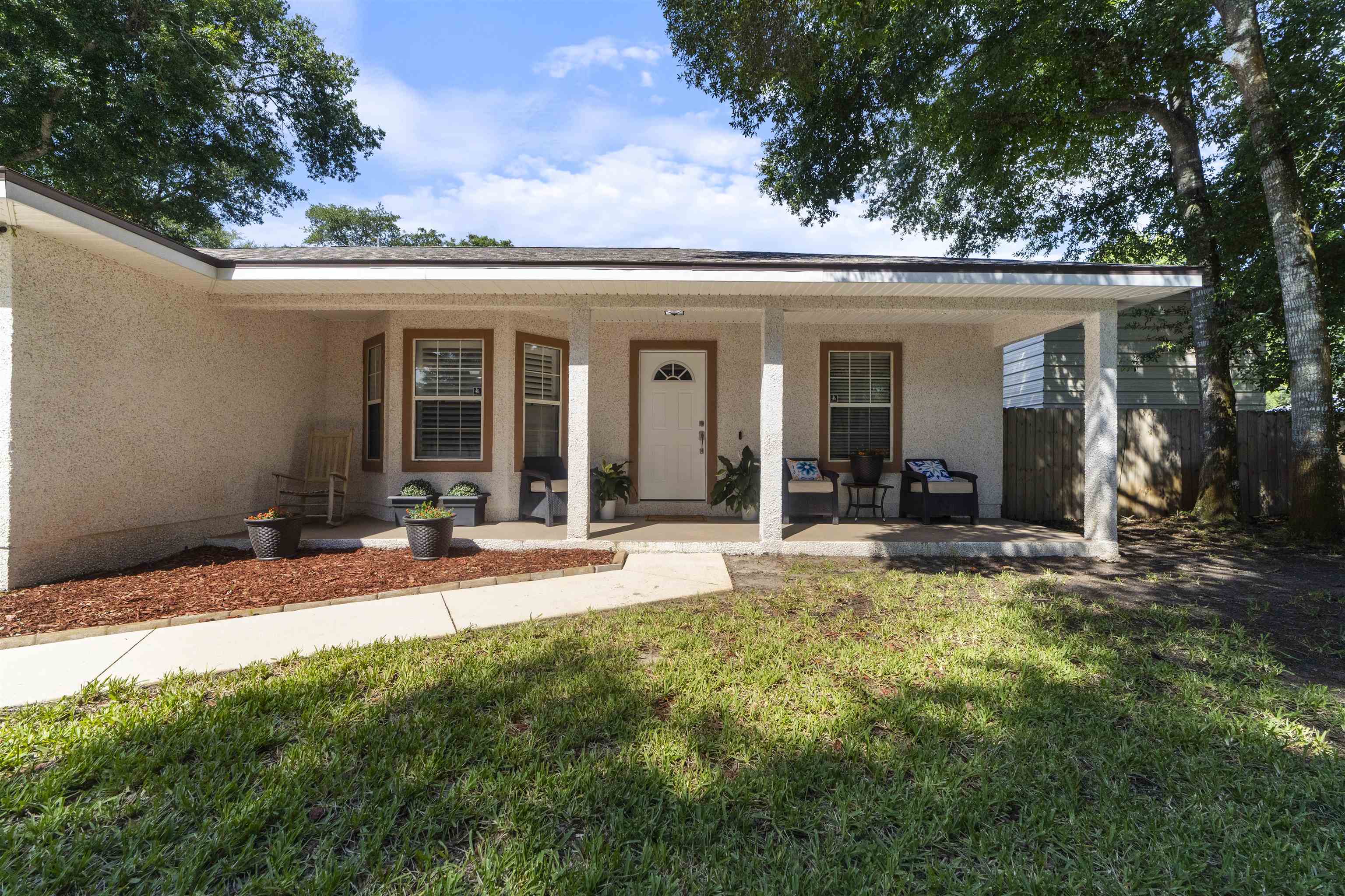 845 Wildwood Drive St. Augustine, FL 32086 - Photo 57 of 58 a view of a house with sitting area and garden