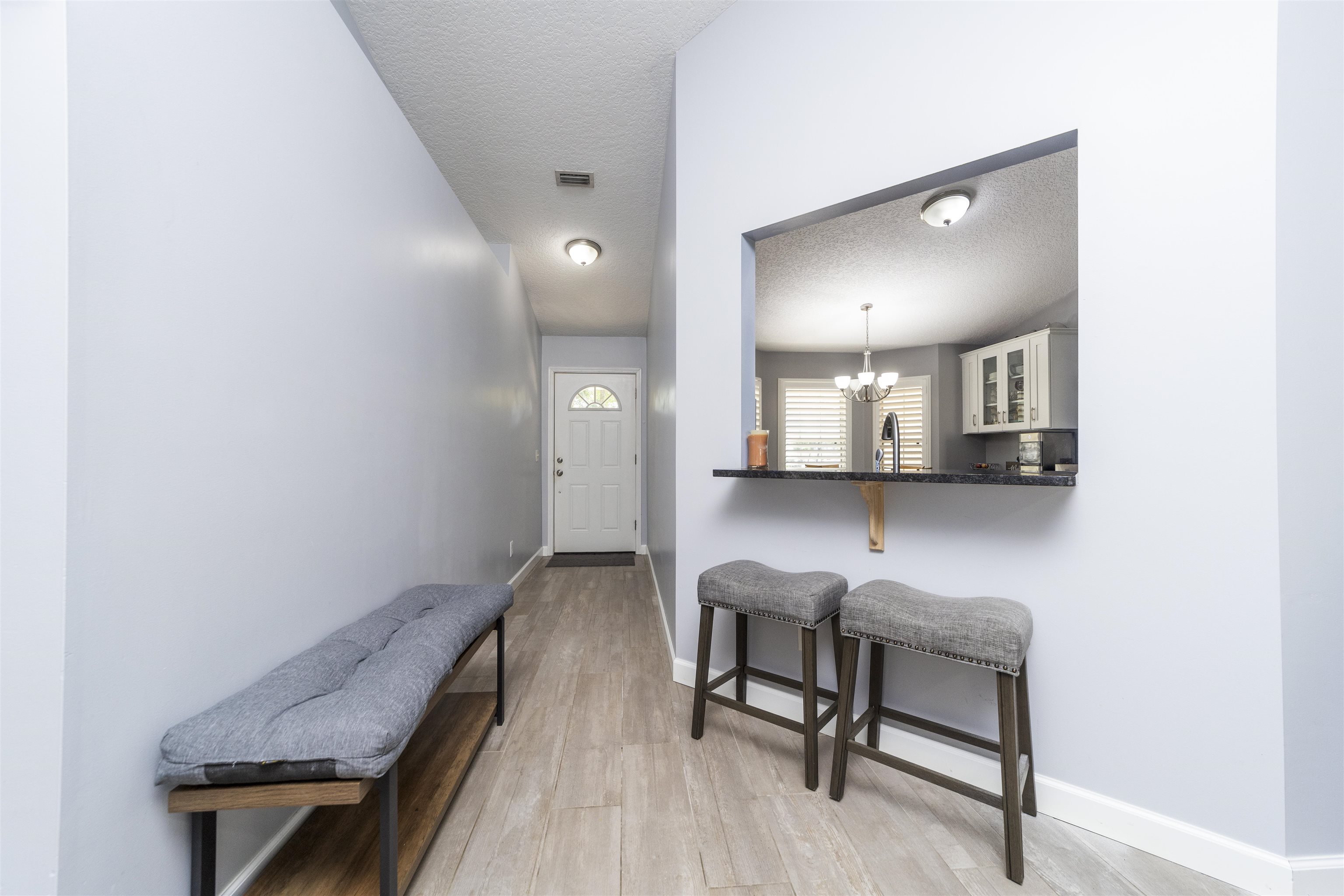 845 Wildwood Drive St. Augustine, FL 32086 - Photo 6 of 58 a view of a hallway with seating area