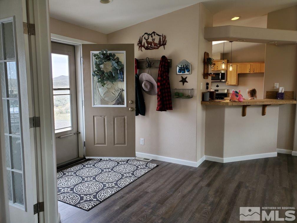 1223 Alum Rock Road Reno, NV 89506 - Photo 5 of 21 a view of a entryway door with hallway and closet