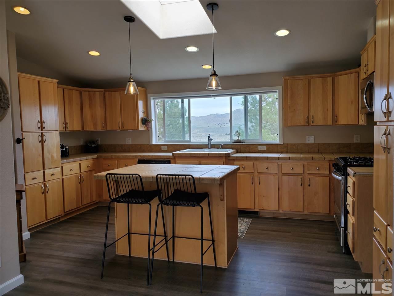 1223 Alum Rock Road Reno, NV 89506 - Photo 8 of 21 a kitchen with a sink cabinets and wooden floor