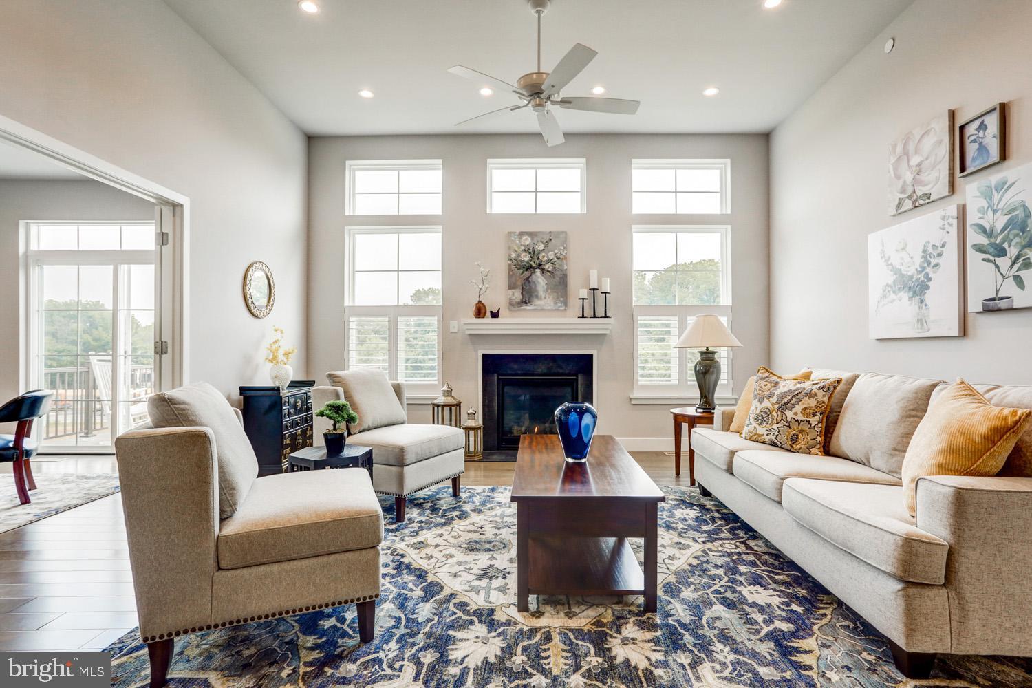 4331 Heather Lane, Unit 44 Columbia, PA 17512 - Photo 4 of 16 a living room with furniture fireplace and large windows