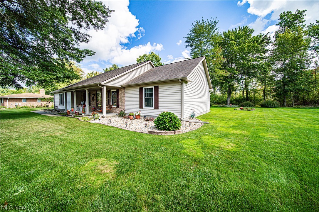 431 Ansel Road Geneva, OH 44041 - Photo 2 of 35 View of front facade with a front yard
