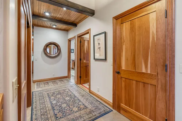 a kitchen with stainless steel appliances granite countertop a sink stove refrigerator and cabinets
