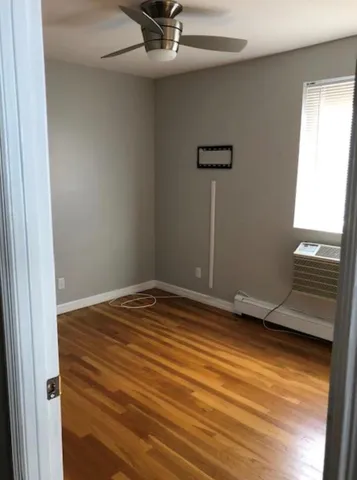 a view of empty room with ceiling fan