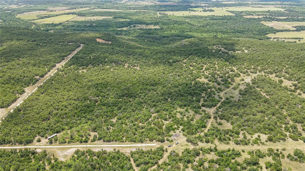 6-0007 Clayton Mt Road Gordon, TX 76453 - Photo 6 of 17 a view of a floor to ceiling window and a yard