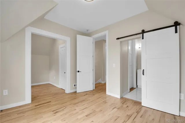 a bathroom with a shower a toilet and sink