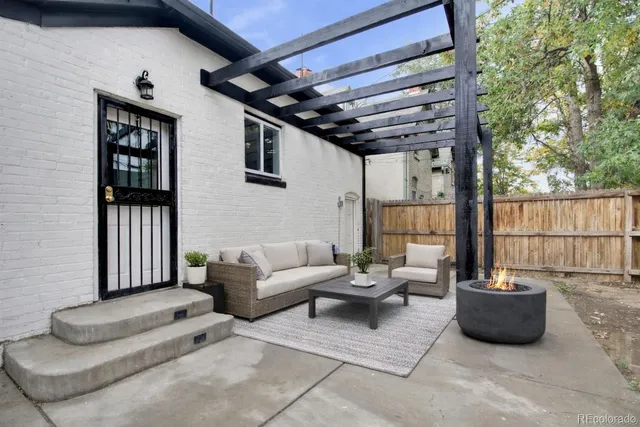 a view of a room with a sink and cabinets