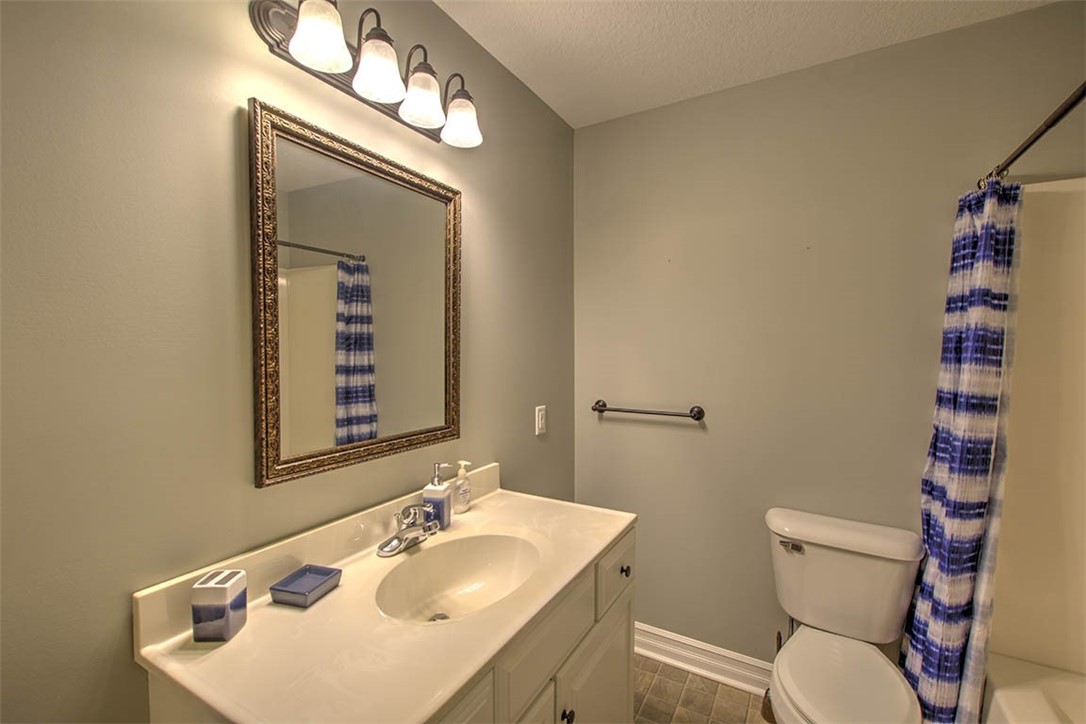 6625 Sherry Court Decatur, IL 62521 - Photo 31 of 42 a bathroom with a sink mirror vanity and toilet