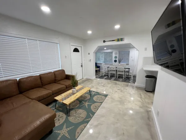 a living room with furniture and a window
