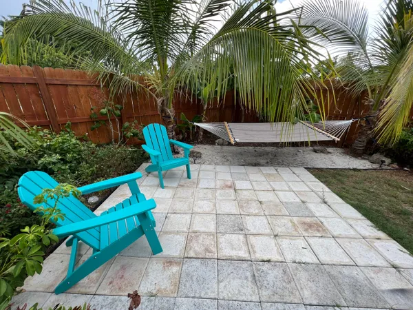 a view of a bench with chairs