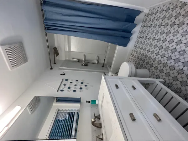 a bathroom with a glass door shower