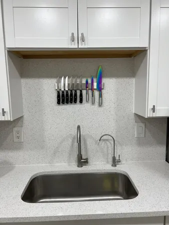 a kitchen with stainless steel appliances a sink counter space and appliances