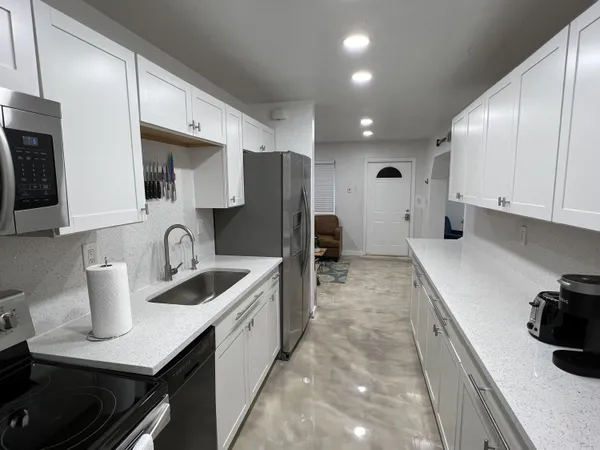 a kitchen with a sink and cabinets