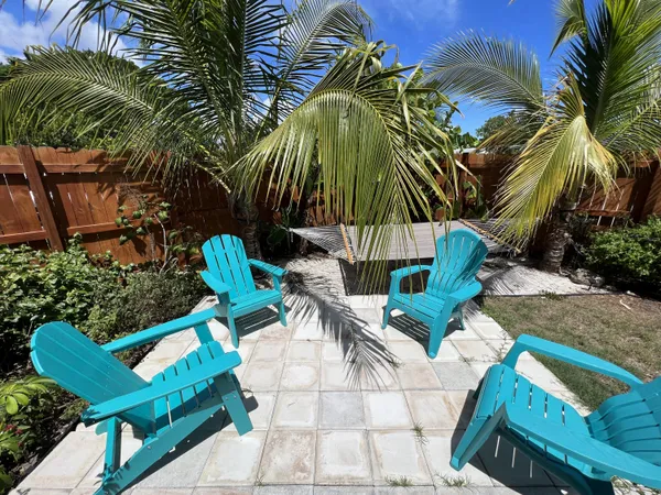 a view of garden with a bench