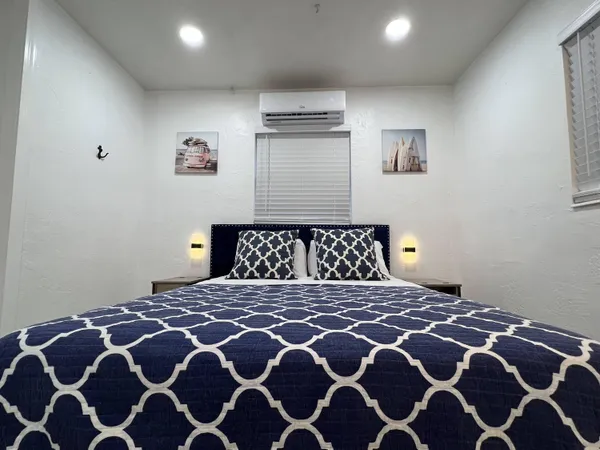 a large bedroom with a bed
