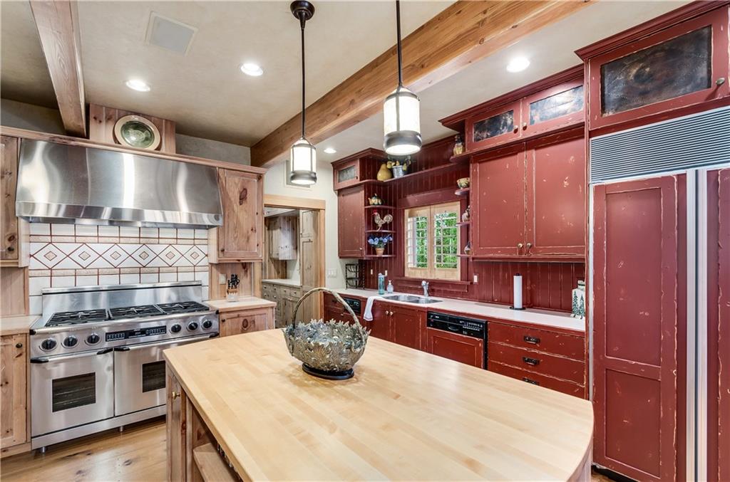 1025 4 O Clock Road Breckenridge, CO 80424 - Photo 11 of 25 a kitchen with stainless steel appliances granite countertop a stove a sink and a refrigerator