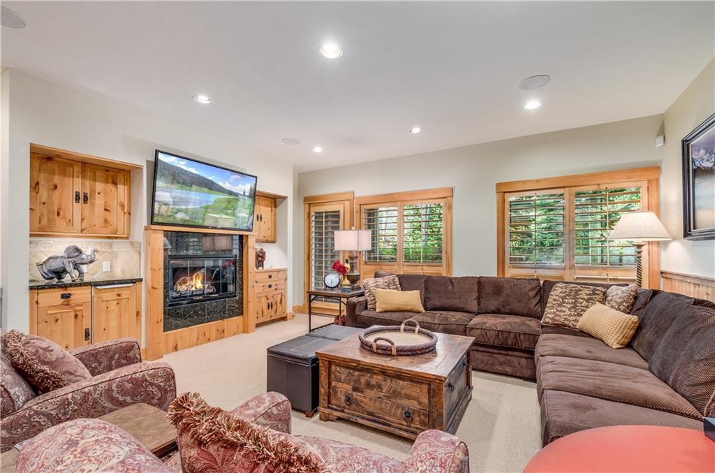 1025 4 O Clock Road Breckenridge, CO 80424 - Photo 15 of 25 a living room with furniture and a flat screen tv