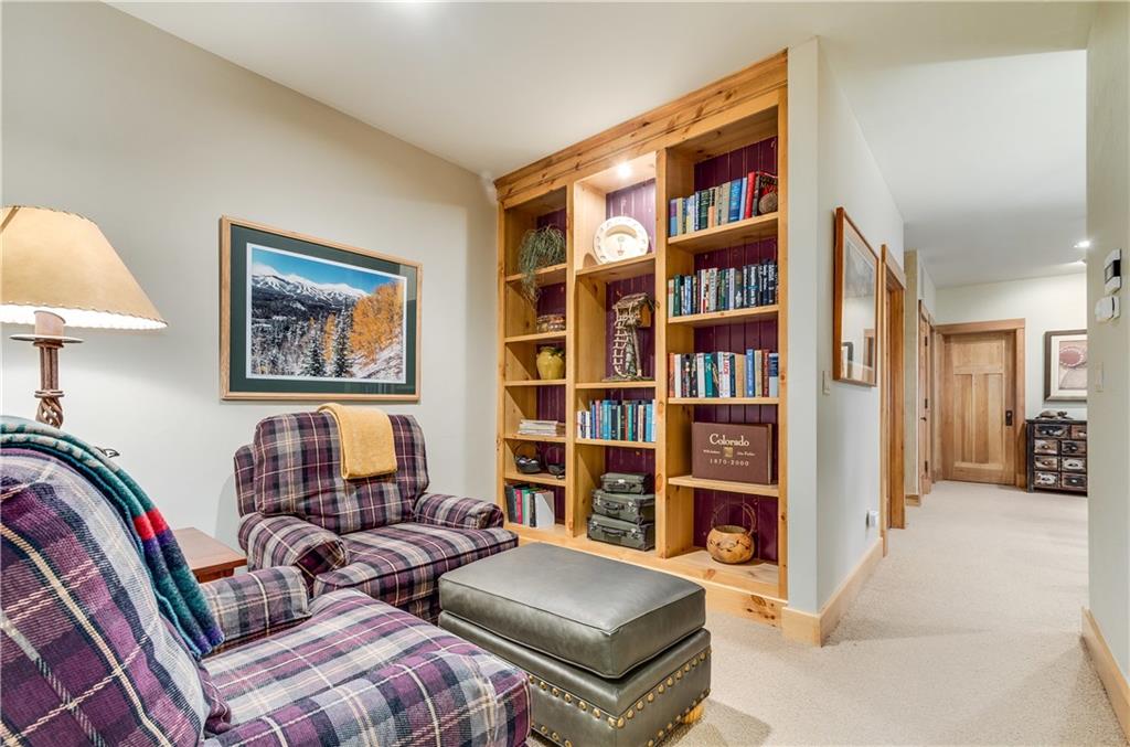 1025 4 O Clock Road Breckenridge, CO 80424 - Photo 19 of 25 a living room with furniture and a book shelf