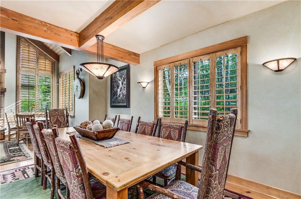 1025 4 O Clock Road Breckenridge, CO 80424 - Photo 3 of 25 a view of a dining room with furniture window and outside view