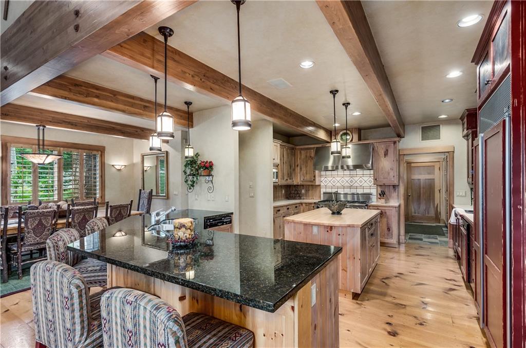 1025 4 O Clock Road Breckenridge, CO 80424 - Photo 4 of 25 a kitchen with stainless steel appliances granite countertop a sink a stove and a refrigerator