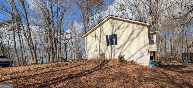 a bed room with a bed and a window